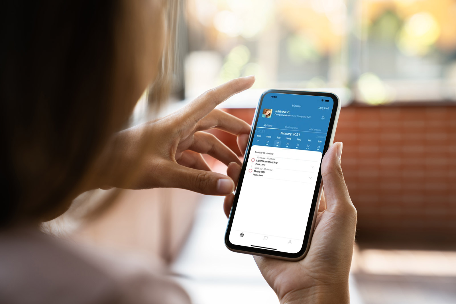 A patient using the WatchWell app to report symptoms between visits